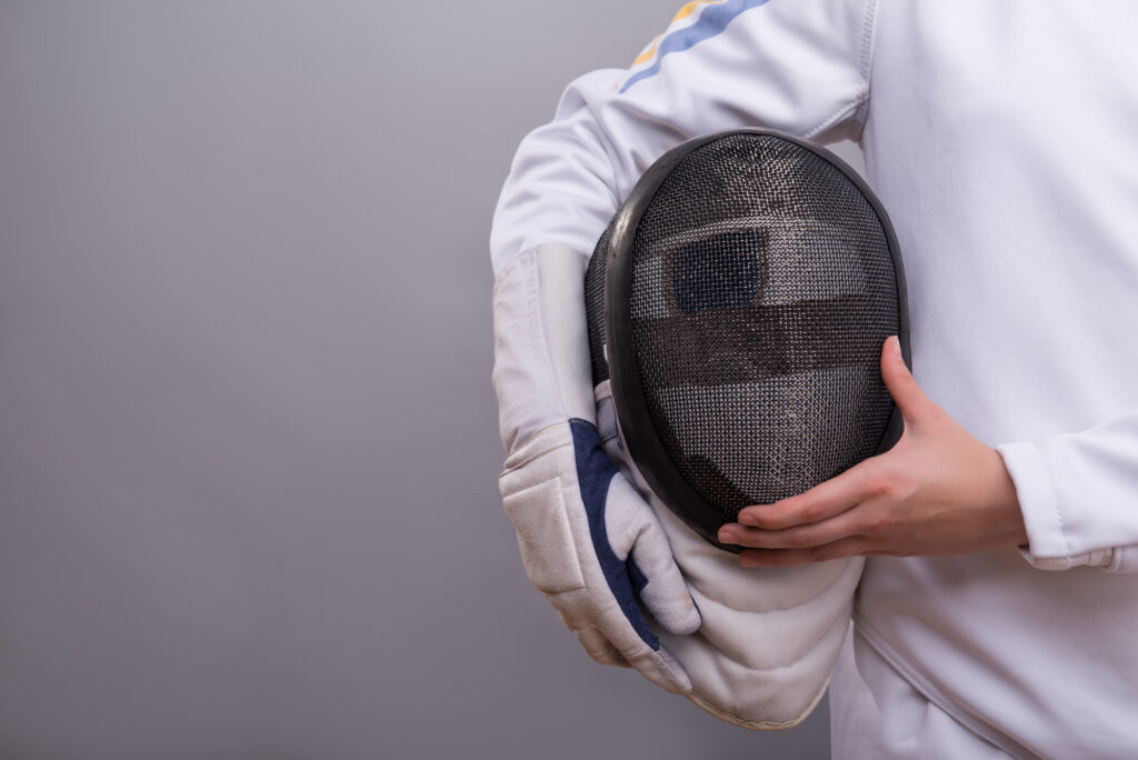 Young woman engaging in fencing